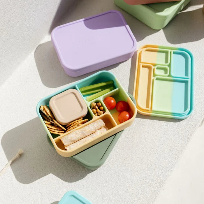 Bento Lunchboxes in assorted colours stacked neatly with lunch inside – sustainable, stylish food storage for kids and adults.