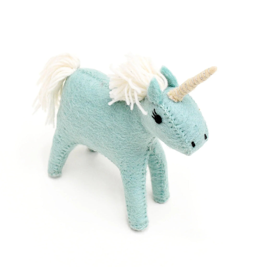 Side profile of the blue felt unicorn toy showing detailed stitching and soft wool texture.
