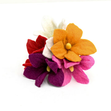 Set of five colourful felt flowers in mustard, pink, white, and plum, arranged upright against a white background.