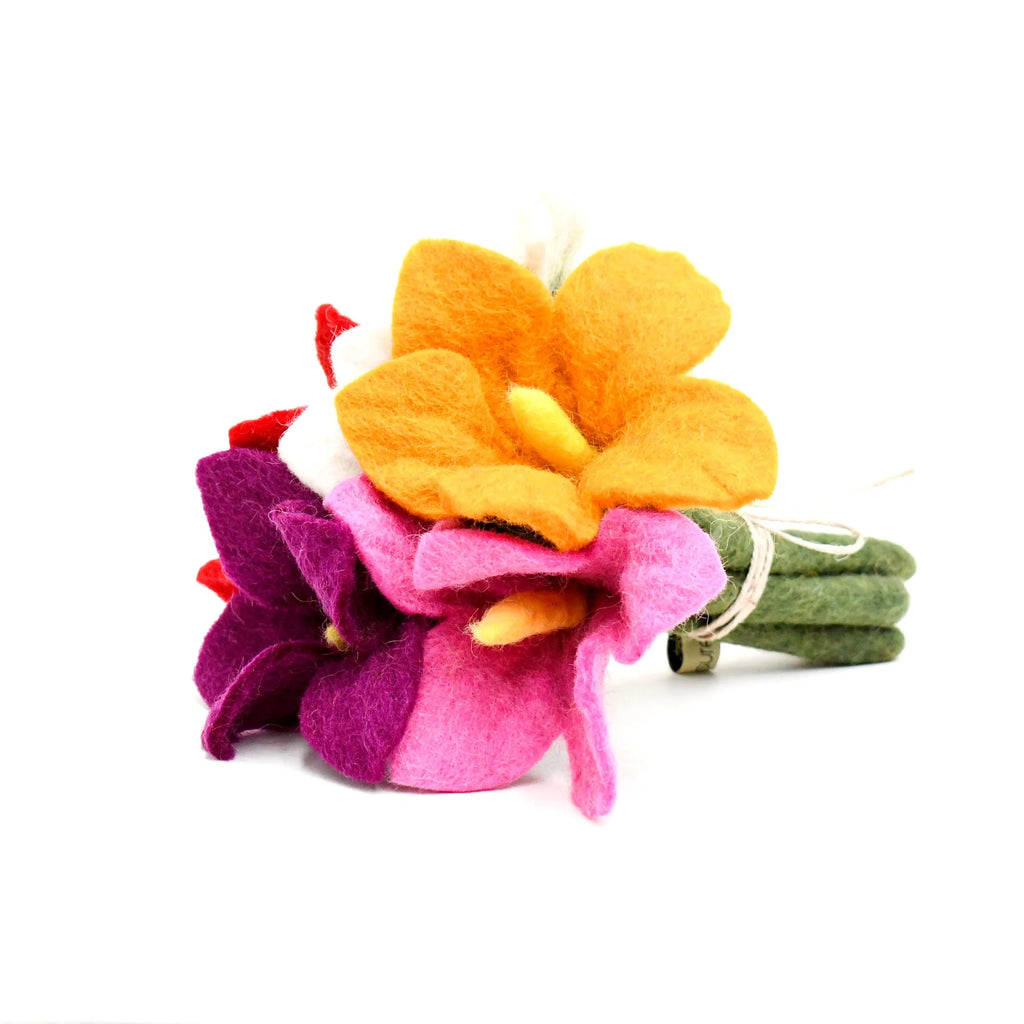 Close-up of yellow felt flower with pink and green felt leaves, highlighting soft wool texture and stitching.