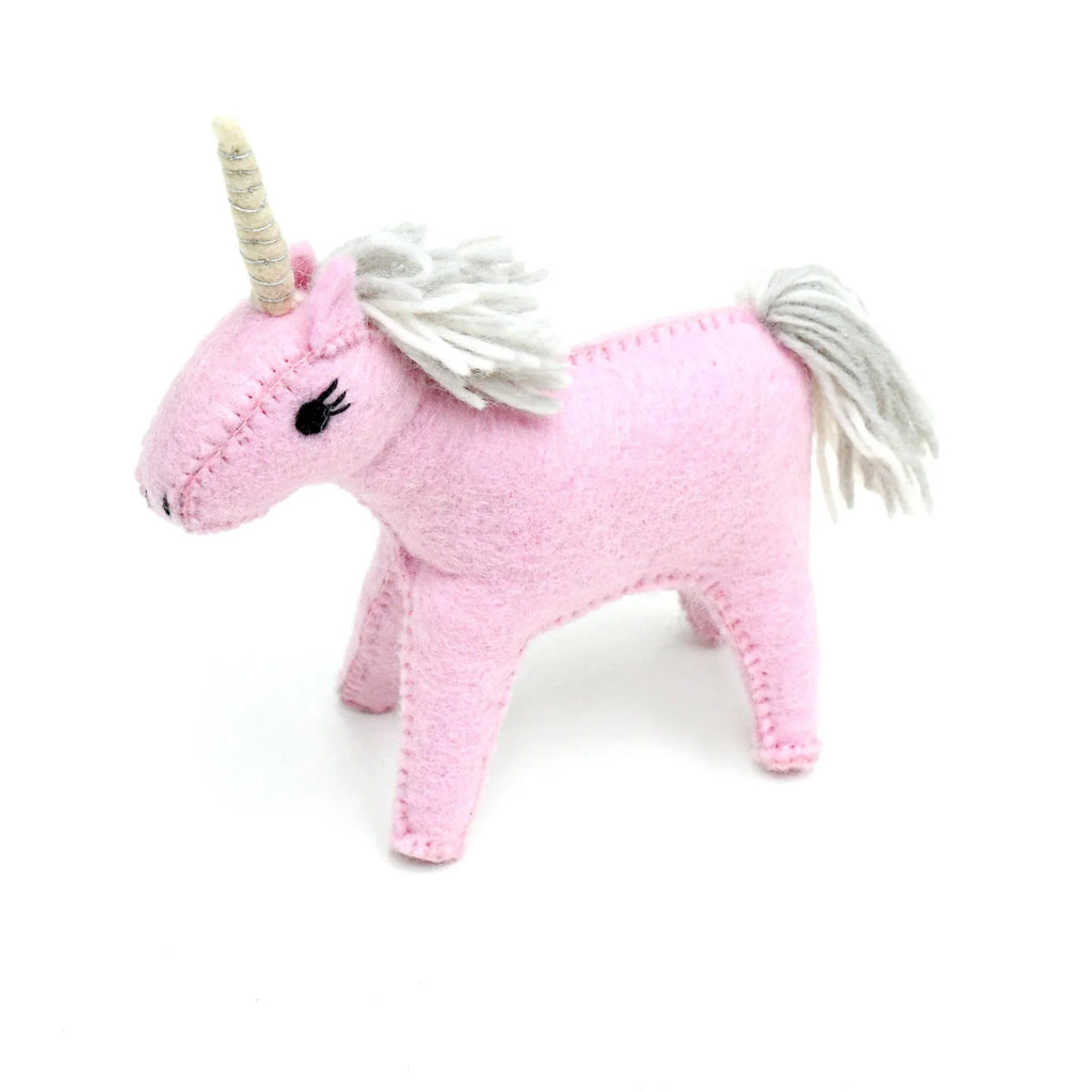 Side view of the soft pink unicorn toy crafted from eco-friendly felt wool, showing delicate stitching details.