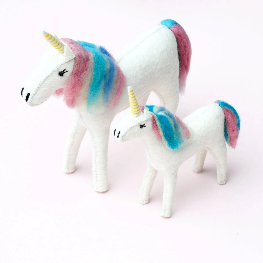 Two felt unicorns—one large and one small—posed side by side against a plain background for size comparison.
