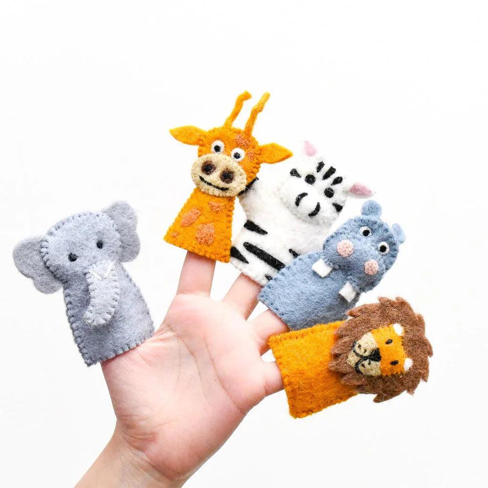 Hand holding five colourful felt finger puppets of safari animals: giraffe, zebra, elephant, lion, and hippo, made from organic wool.