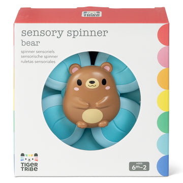 Tiger Tribe Sensory Spinner Bear in packaging, showing the cute brown bear face at the centre of a four-paddle blue spinner, suitable for ages 6 months to 2 years.