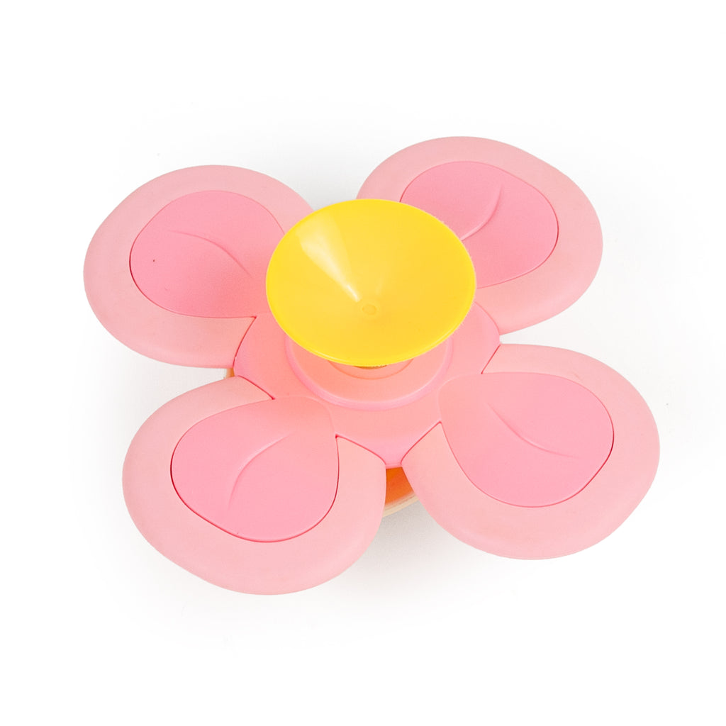 Back view of the Bunny Sensory Spinner showing yellow suction cup and pink spinner arms, designed to stick to smooth surfaces like mirrors or windows.