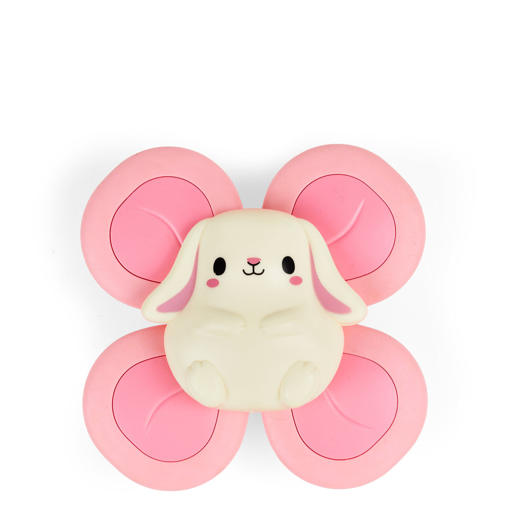 Close-up of the Bunny Sensory Spinner out of packaging with soft pink paddles and a sweet bunny face in the centre, encouraging spinning and tactile play.
