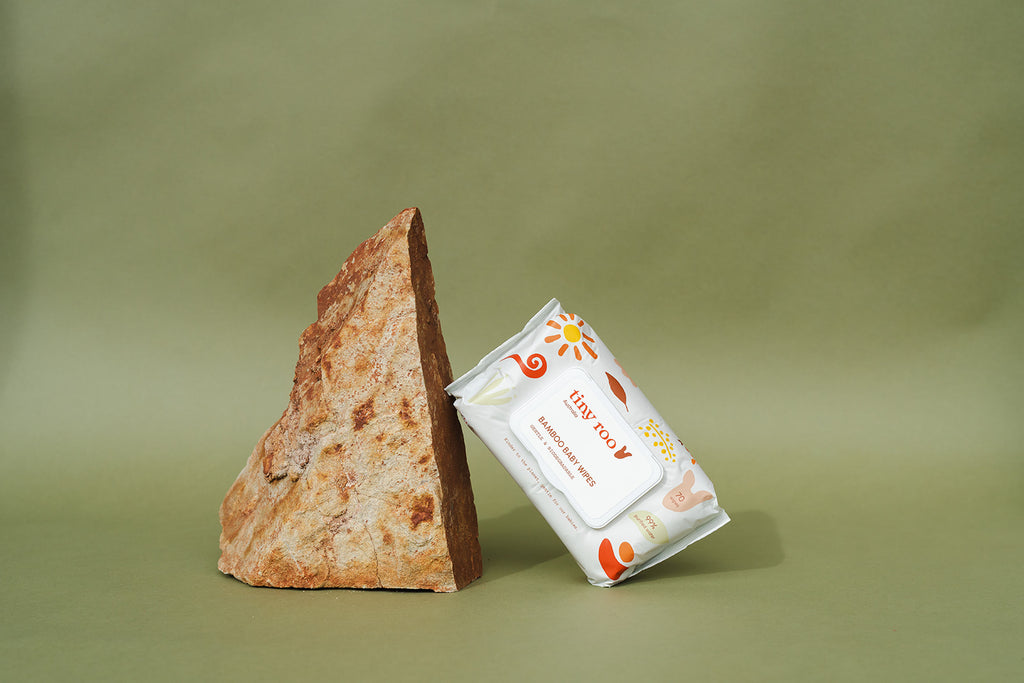 Tiny Roo bamboo baby wipes styled with natural props, highlighting eco-friendly values and sustainable, chemical-free formulation.