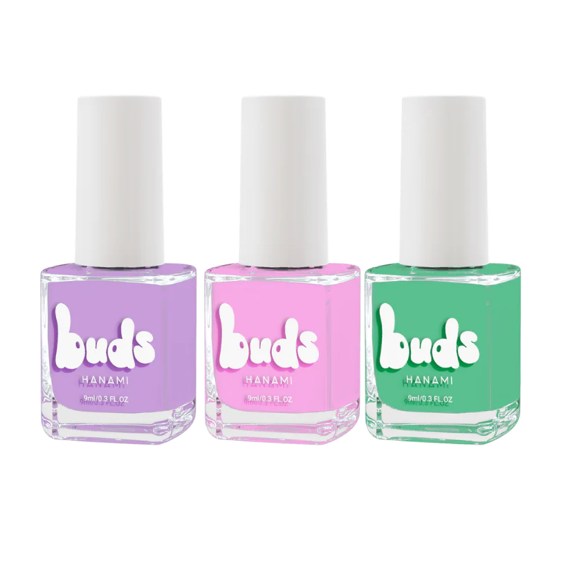 Three Buds Hanami kids’ nail polish bottles in a row: lavender purple, light pink, and bright green, displayed against a clean white background.