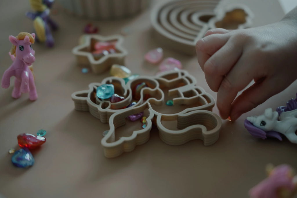 Kinfolk Pantry eco unicorn-themed cutters styled with glitter stars and rainbow shapes for imaginative play.
