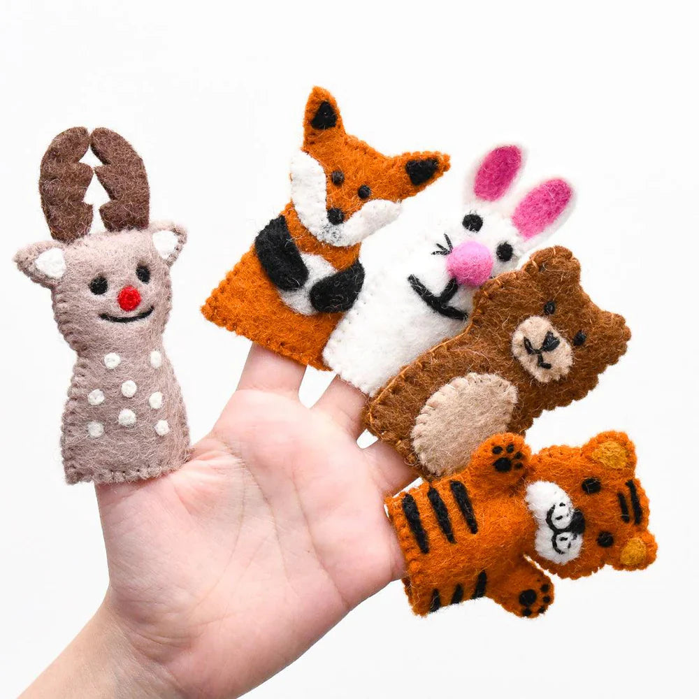 Hand holding five felt finger puppets including a reindeer, fox, rabbit, bear, and tiger from the woodland animals set.