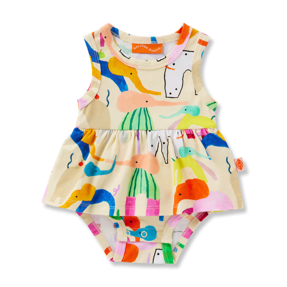Flat lay of Halcyon Nights Happy Herd Singlet Dress for babies, featuring colourful animal illustrations, frill waist detail, and built-in bodysuit design.