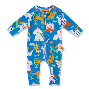 Halcyon Nights Puppy Park Long Sleeve Romper flat lay showing colourful illustrated puppies, toys, and suns on a bright blue background.
